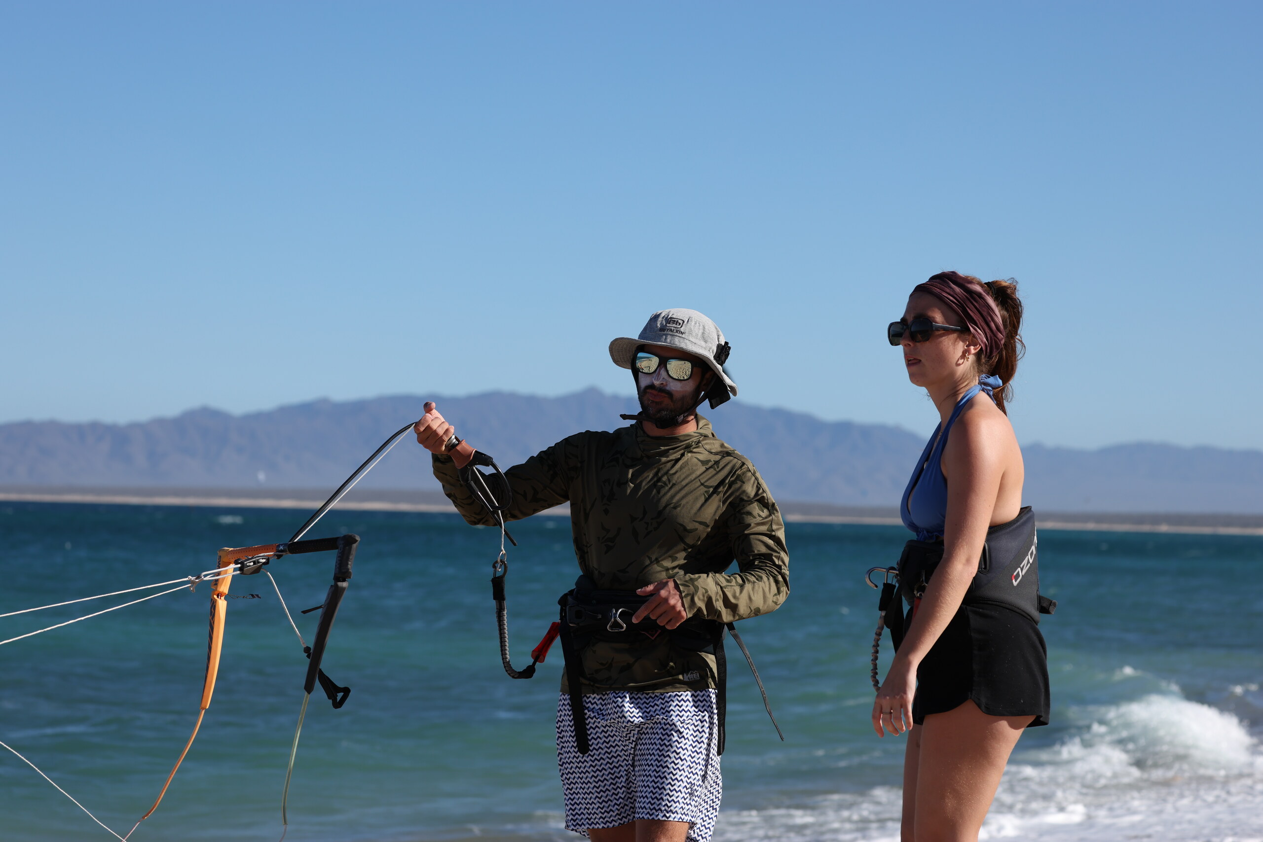 Kiteboarding instructor coaching a student by the sea in La Ventana